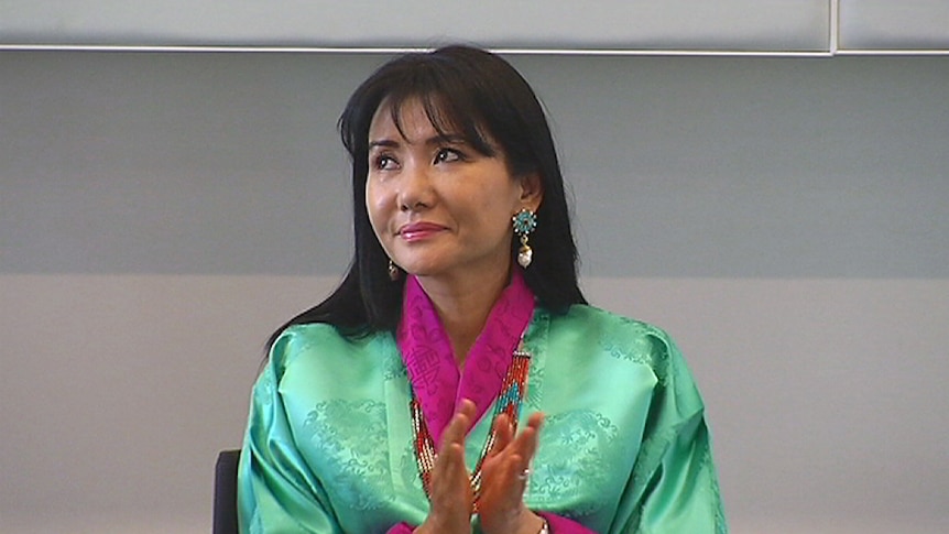 Queen mother of Bhutan, Her Majesty Gyalyum Sangay Choden Wangchuck applauds during her visit to the University of Canberra.