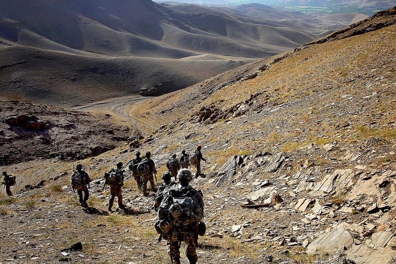 US soldiers travel down a mountain during a patrol near the Tangi Valley in Afghanistan