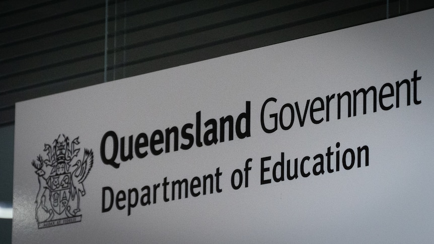 A sign that says "Queensland Government Department of Education".