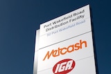A large sign saying Metcash with other logos