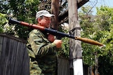 Armed pro-Russian separatists stand guard in Siversk