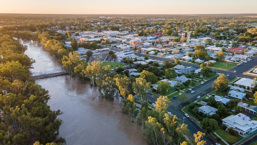 Aerial image of a river in flood and adjacent town
