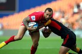 Star showing ... Quade Cooper is tackled by Chiefs counterpart Aaron Cruden in Hamilton