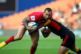 Star showing ... Quade Cooper is tackled by Chiefs counterpart Aaron Cruden in Hamilton