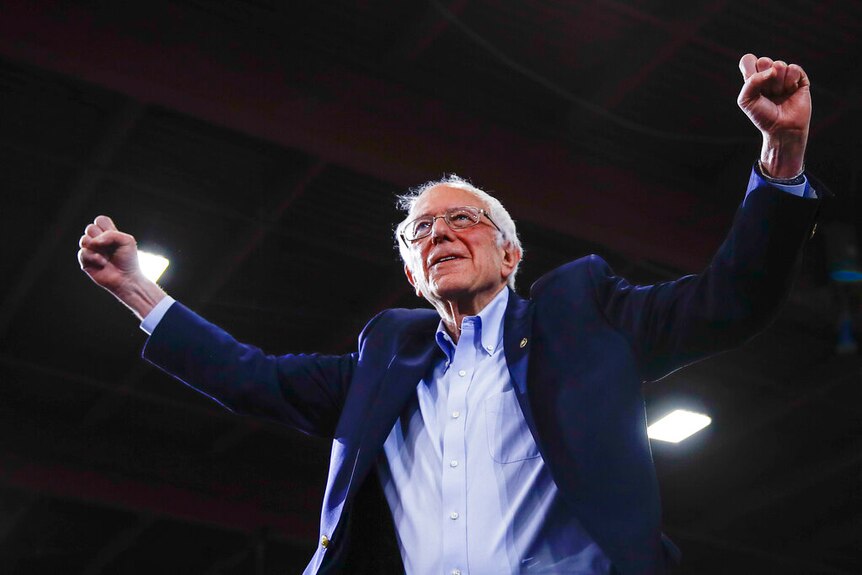 A photo of Bernie Sanders rejoicing.