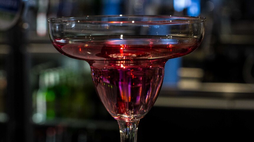 A pink alcoholic drink