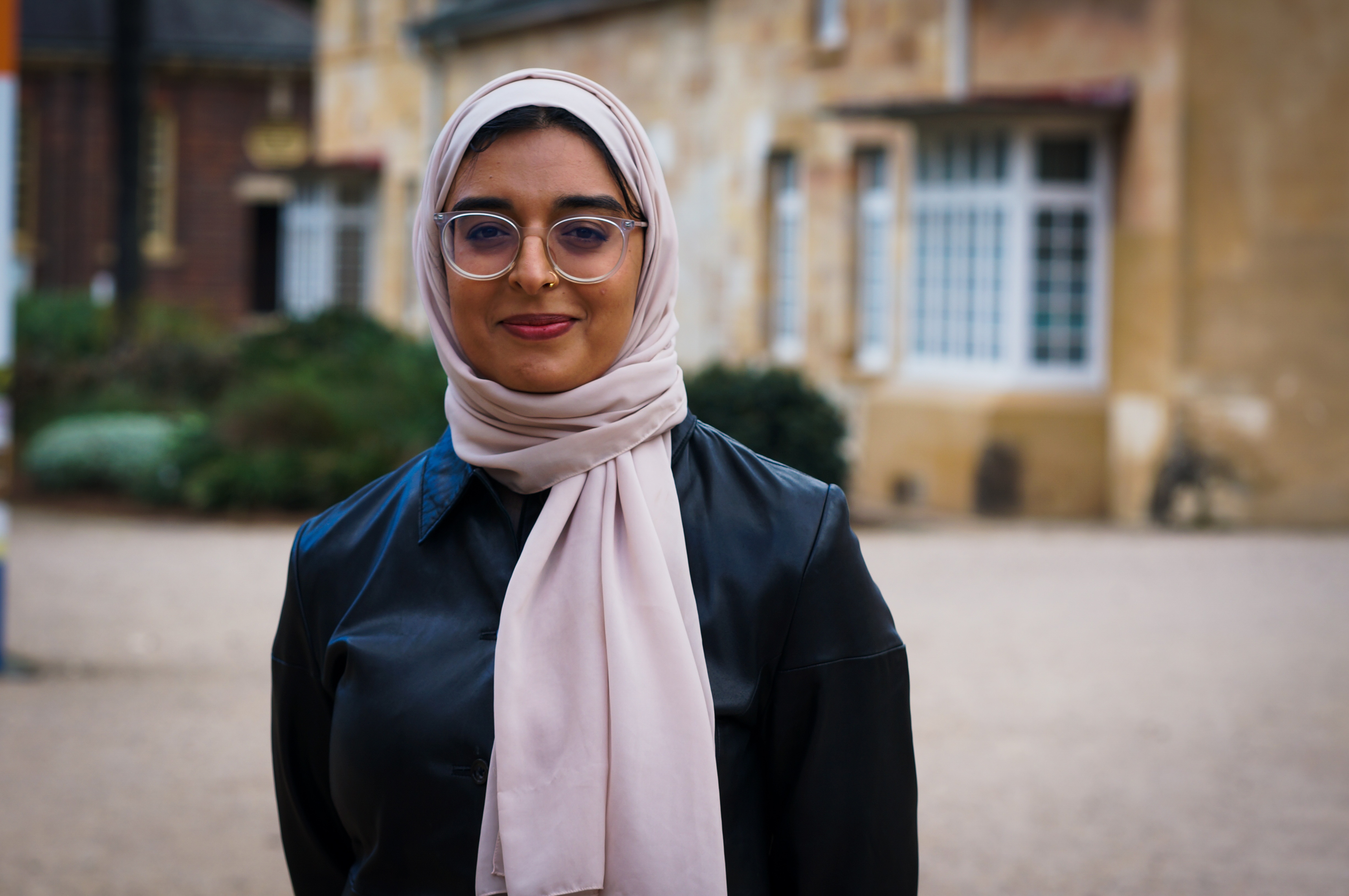 Khadija Ibtisam outside a building