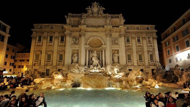 Rome's famous Trevi Fountain with lights on (top) and the lights turned off during Earth Hour