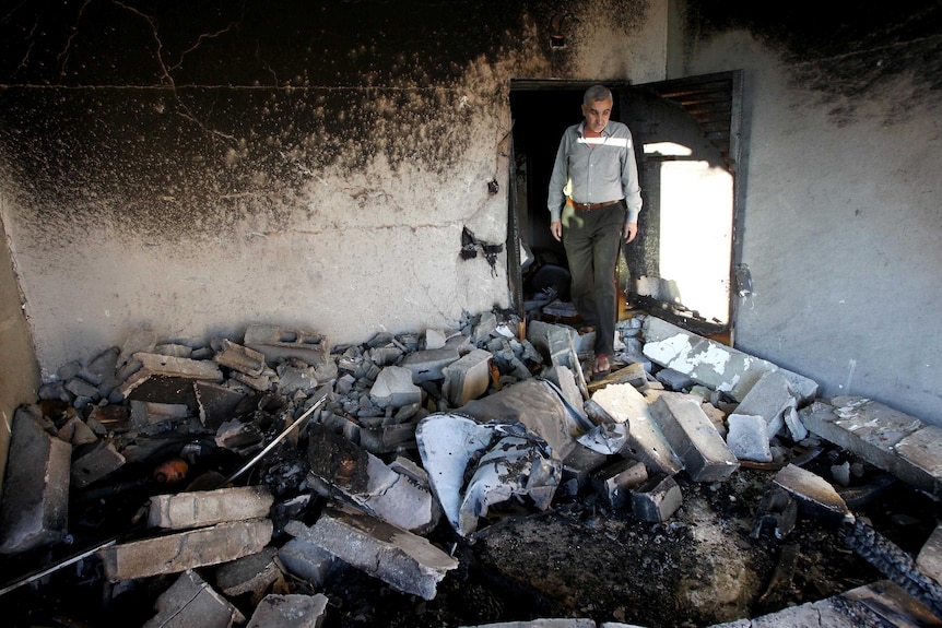 House of Palestinian named by Israel as murder suspect is blown up.