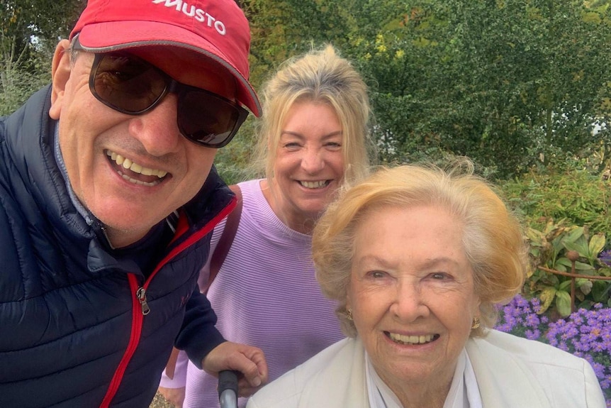 Michael Etherington with his mother and a friend in an English garden.