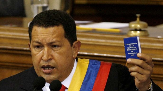 All change: Venezuelan President Hugo Chavez holds up a copy of the constitution