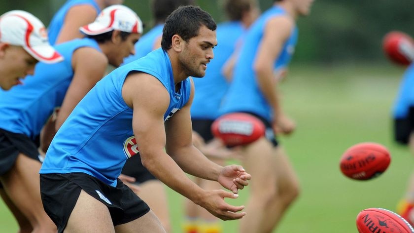 First run: Karmichael Hunt took part in training for the first time with his Gold Coast team-mates.