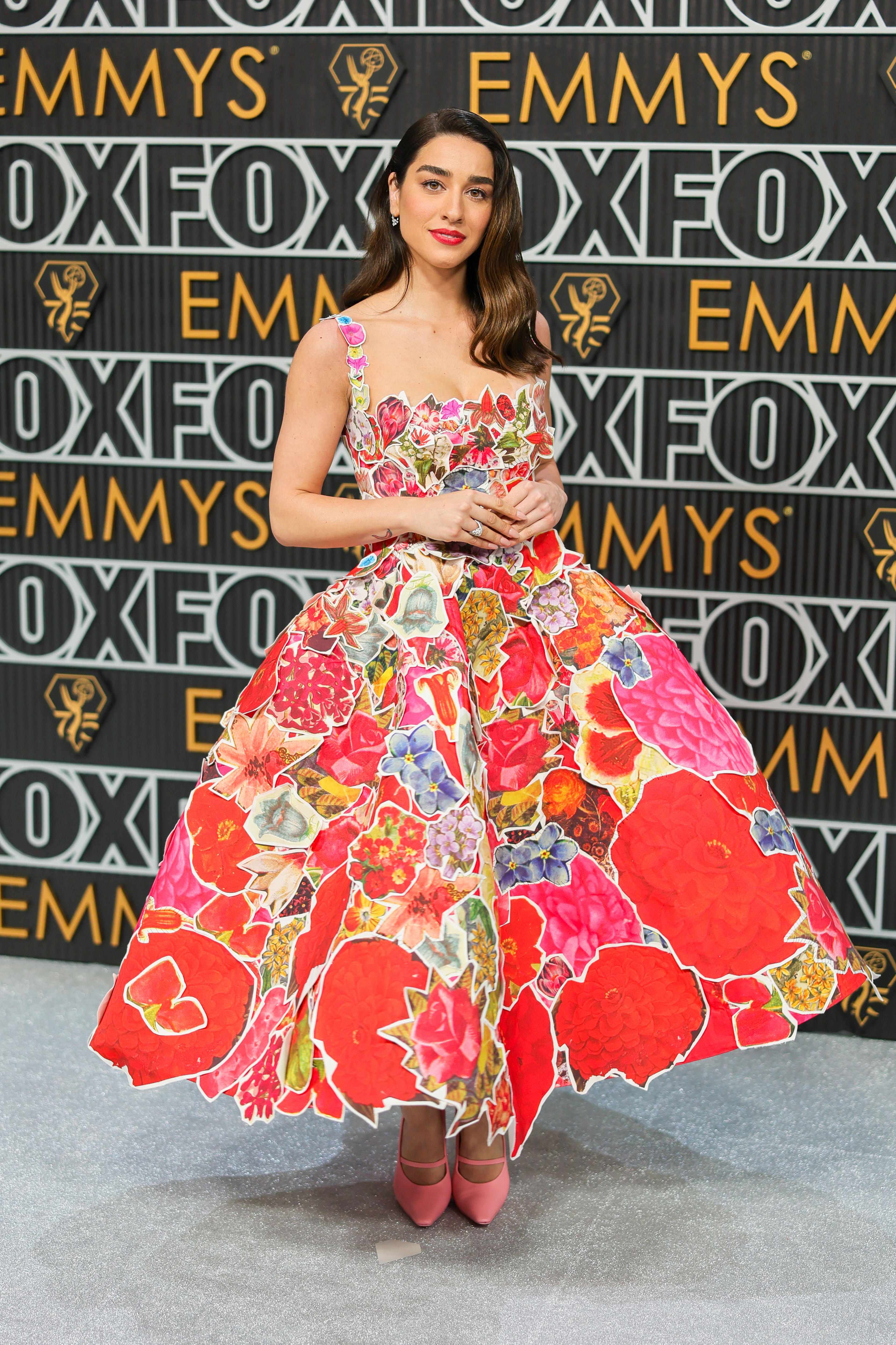 A woman in a floral dress on the red carpet
