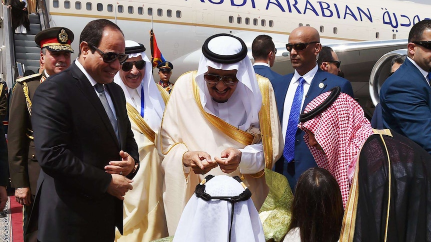 Egyptian President Abdel Fattah al-Sisi welcoming Saudi King Salman