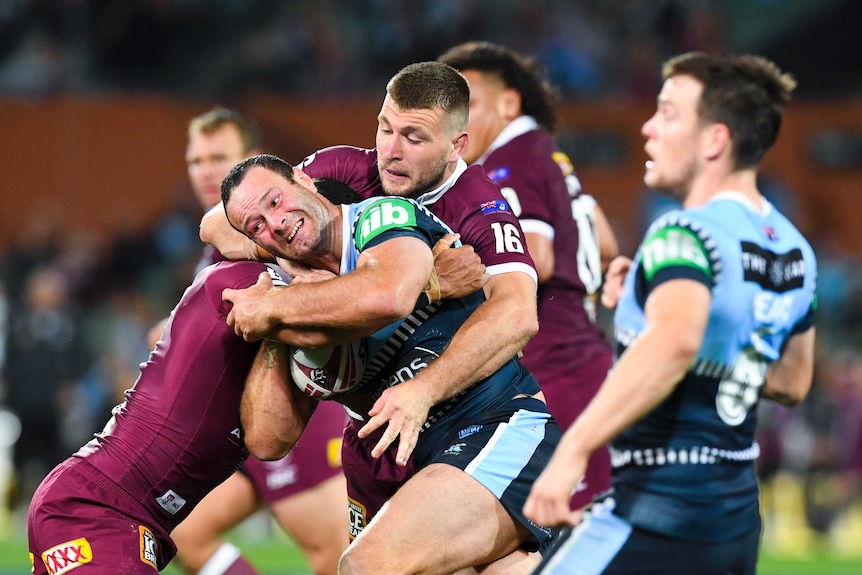 NSW Blues captain Boyd Cordner is tackled by Queensland Maroons' Jai Arrow in State of Origin.