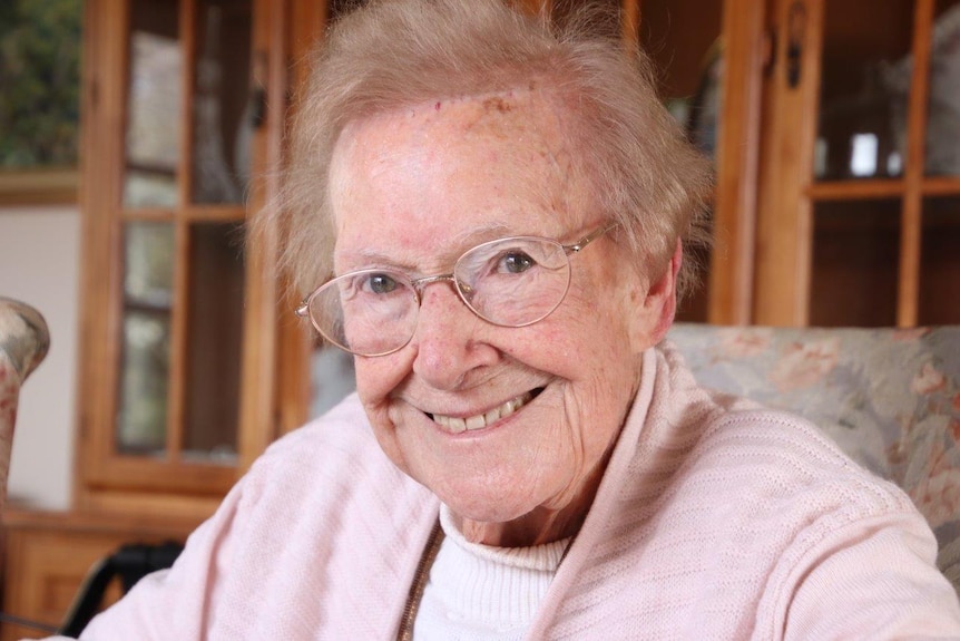 Launceston woman Joan Webb sits at her desk