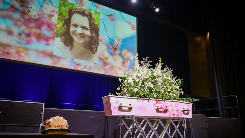 The coffin of a volunteer firefighter at her funeral.