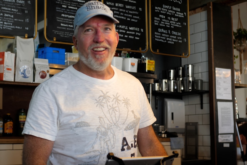 Christian Watters standing in the Jaffle Shack, smiling.