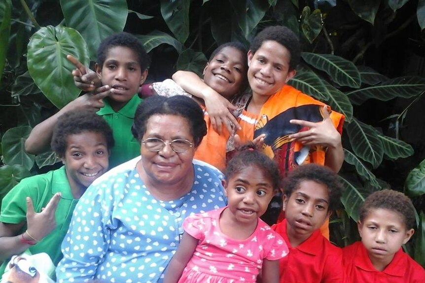 Rosa Kepo with children from the Bible Faith Orphanage Outreach Centre
