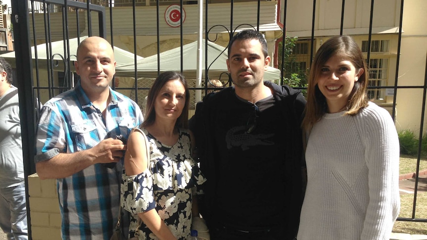 Four Turkish Australians stand outside Turkey's consulate in Sydney.