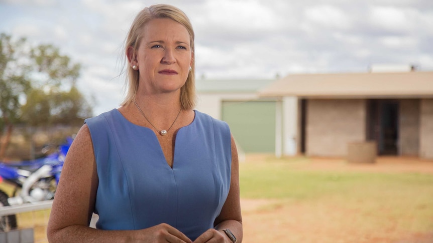 Northern Territory Deputy Chief Minister Nicole Manison stands outside a house in Alice Springs.