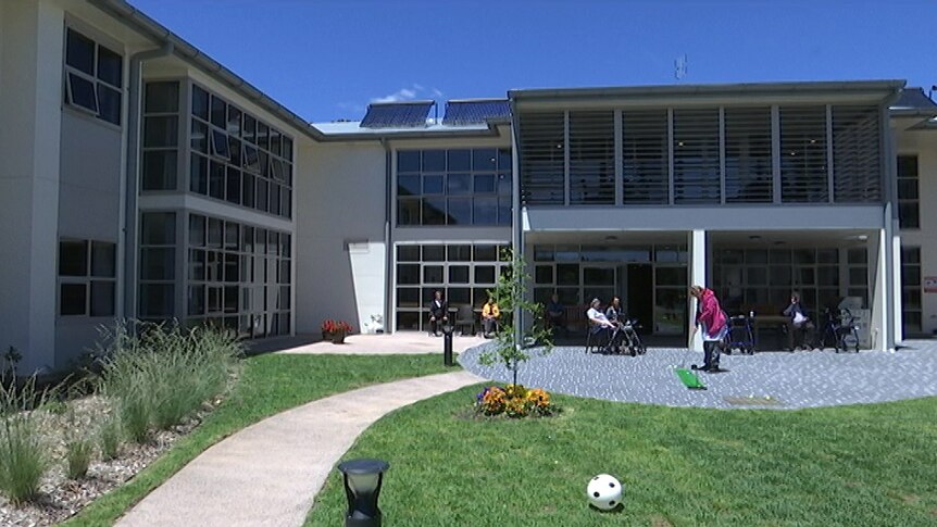 Exterior shot of building with garden.