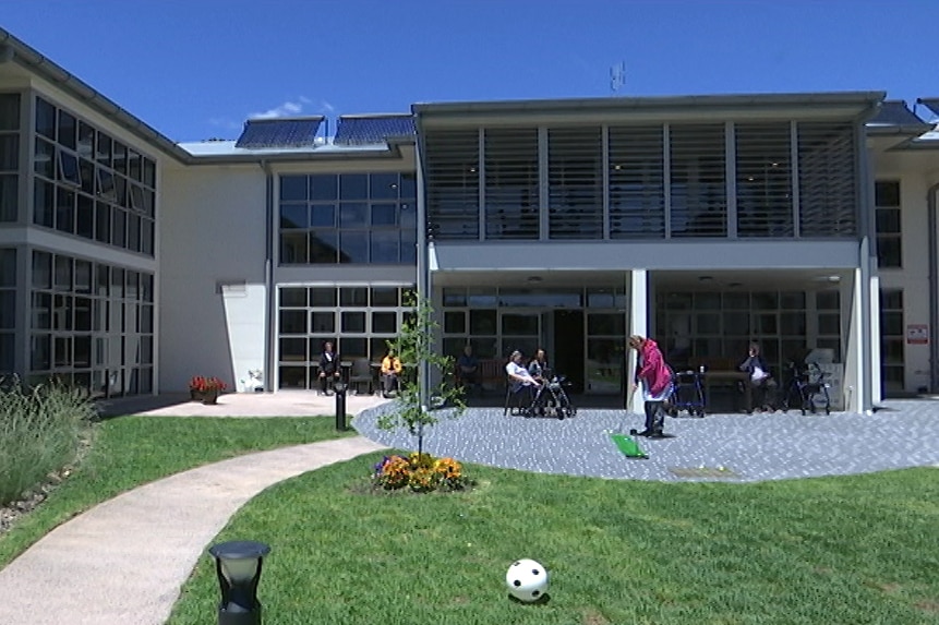 Exterior shot of building with garden.