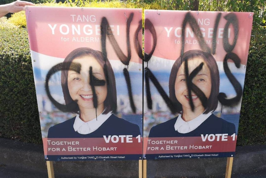 Defaced election posters of Hobart council candidate Yongbei Tang.