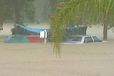Flood waters rise ... the Helensvale caravan park on the Gold Coast