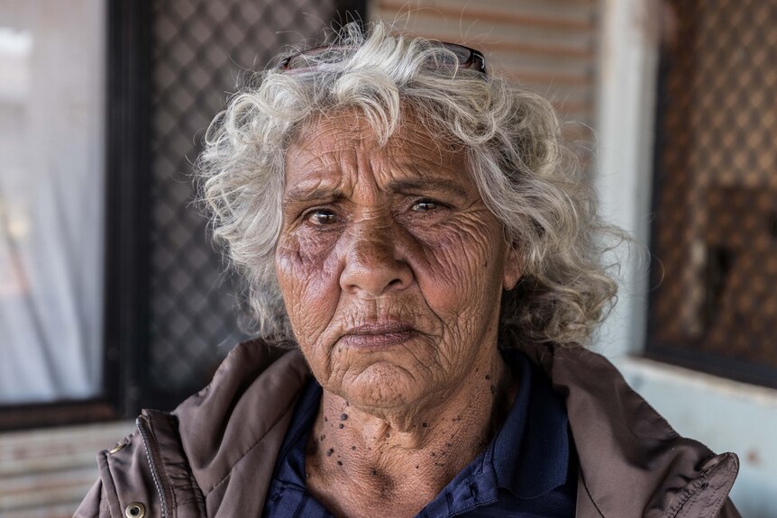 A portrait of an elderly Aboriginal woman.