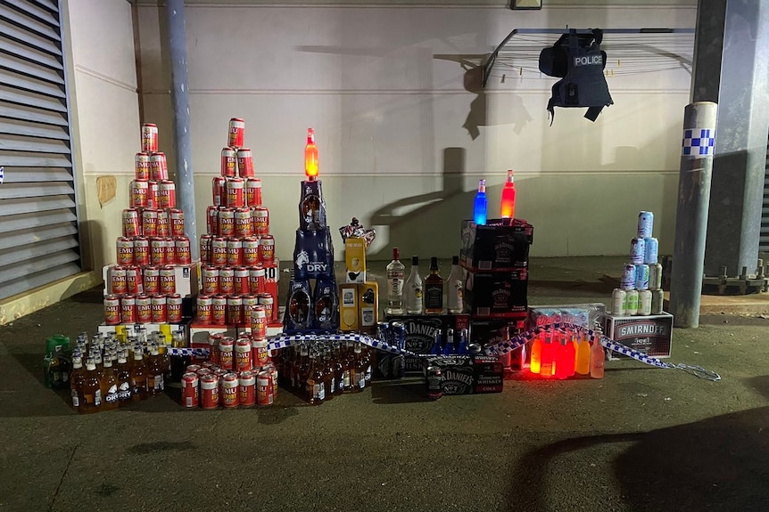 stacks of alcohol covered in police tape