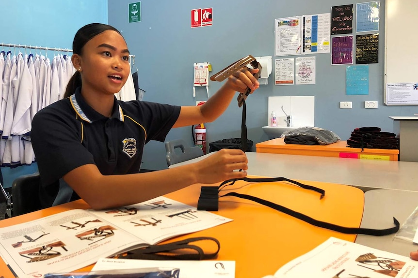 Year 8 student Georgia Angat working at a desk in a classroom at Mabel Park State High School.