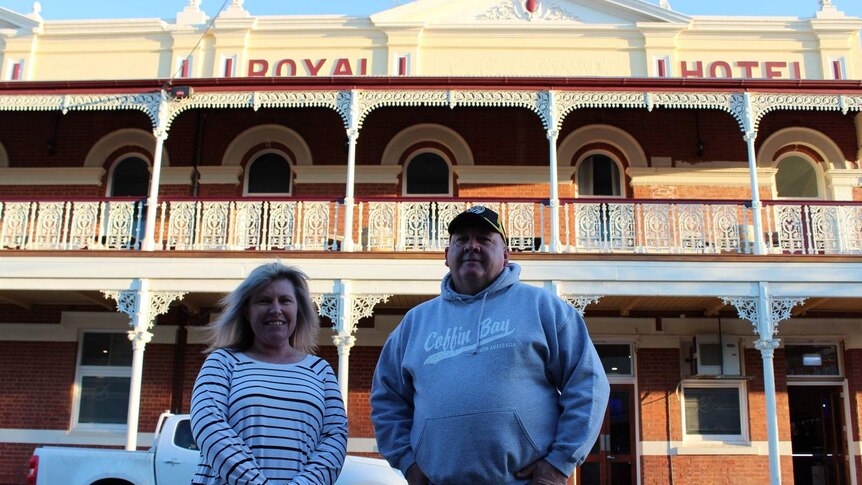 Alison McClelland and John Clohesy standing in front of the Royal Hotel in Sea Lake.