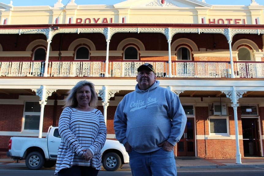 Alison McClelland and John Clohesy standing in front of the Royal Hotel in Sea Lake.