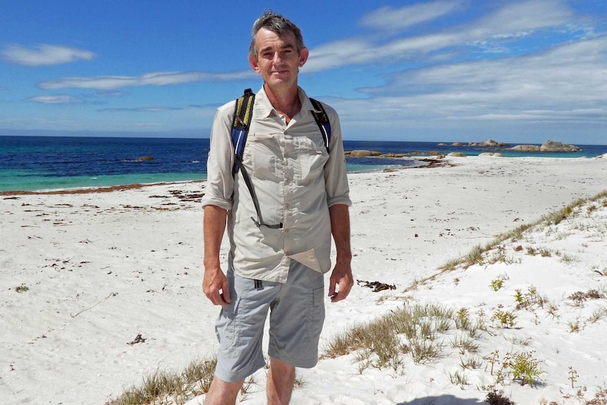 Tour guide Ben Lord on a Tasmanian beach