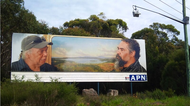 A  billboard with Derek Kreckler's photograph