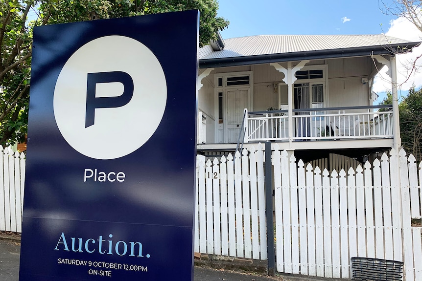 Renovated wooden cottage with For Auction sign at Woolloongabba in  Brisbane.