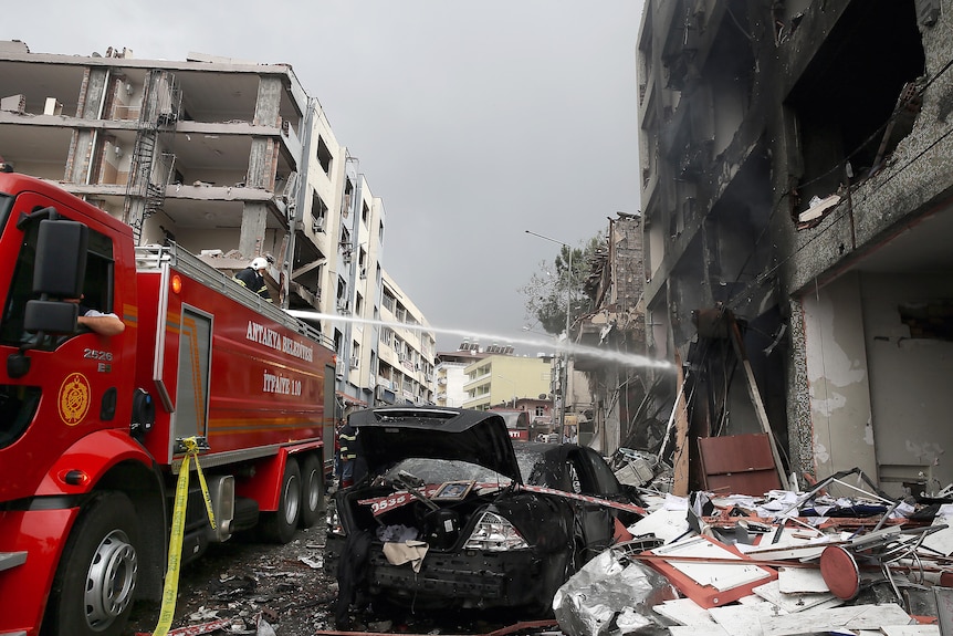 Firefighters tackle a blaze after a double suicide bombing in Reyhanli, southern Turkey.