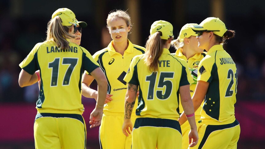 Ellyse Perry celebrates a wicket with teammates