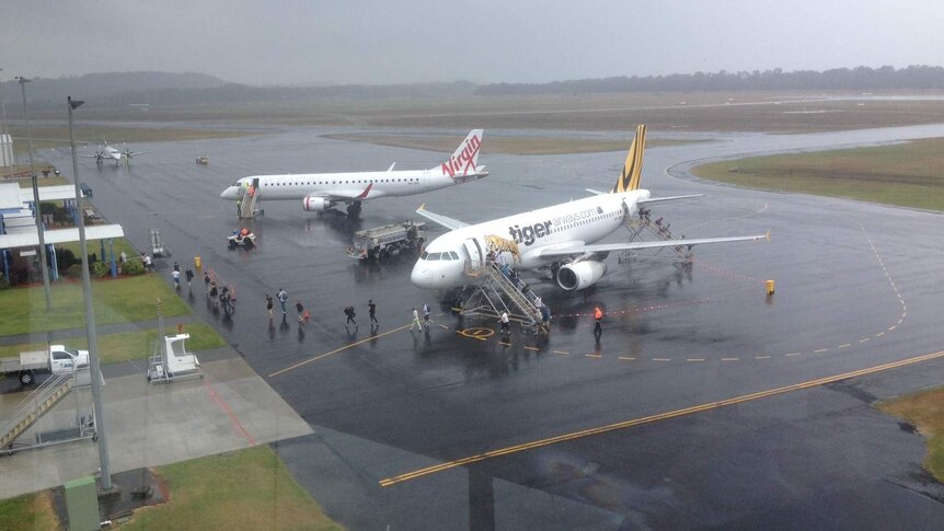 Planes waiting on tarmac at Coffs Harbour regional airport