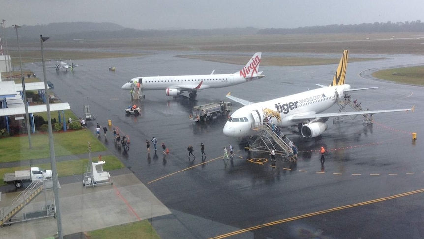 Planes waiting on tarmac at Coffs Harbour regional airport
