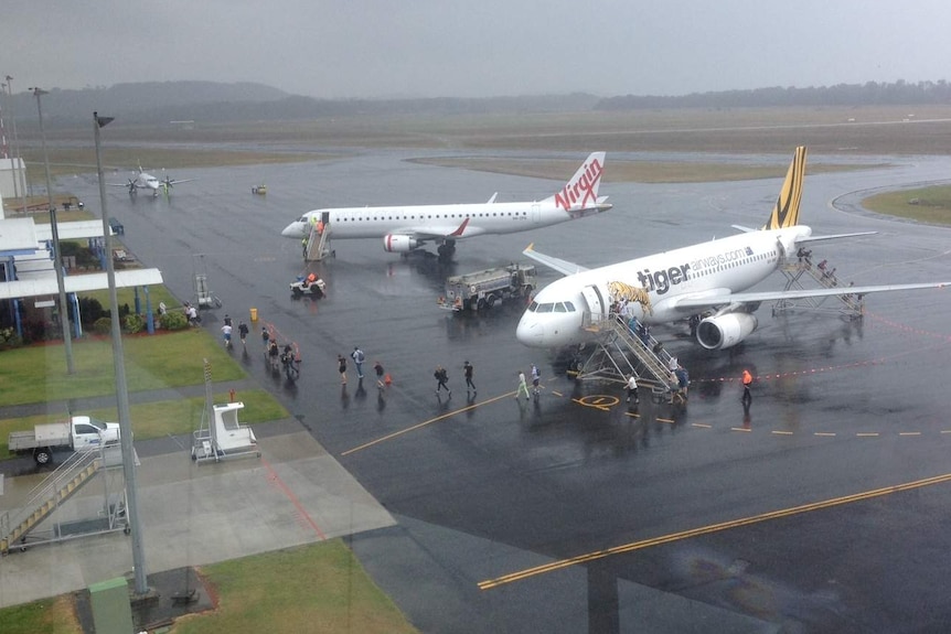 Planes waiting on tarmac at Coffs Harbour regional airport