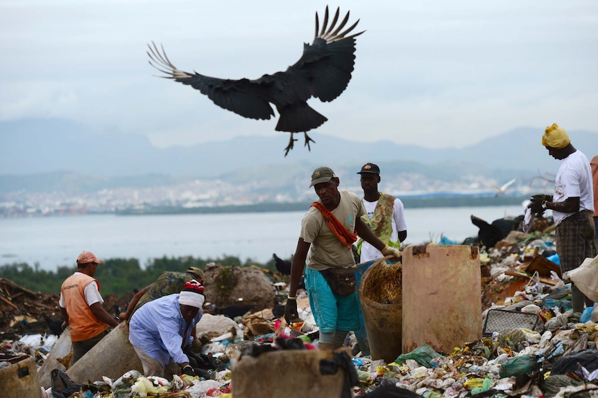'Catadores' (scavengers) collect recyclable rubbish from the Jardim Gramacho landfill