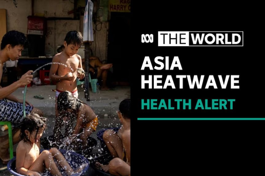 Asia Heatwave, Health Alert: A man soaks children with a garden hose.