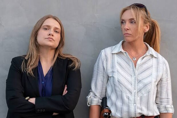Merrit Weaver and Toni Collette, in costume as police officers on the set of Unbelievable