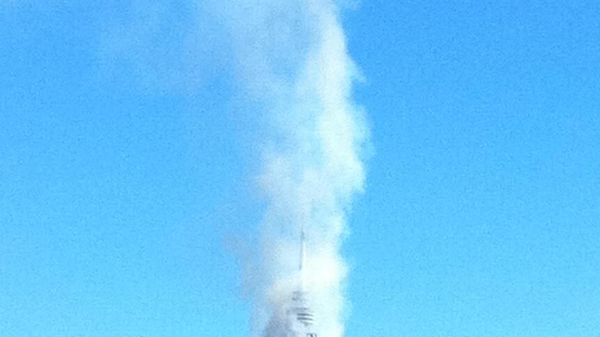 Under control: Smoke from a controlled burn surrounds Black Mountain tower.