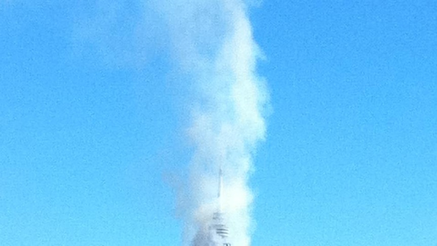 Under control: Smoke from a controlled burn surrounds Black Mountain tower.