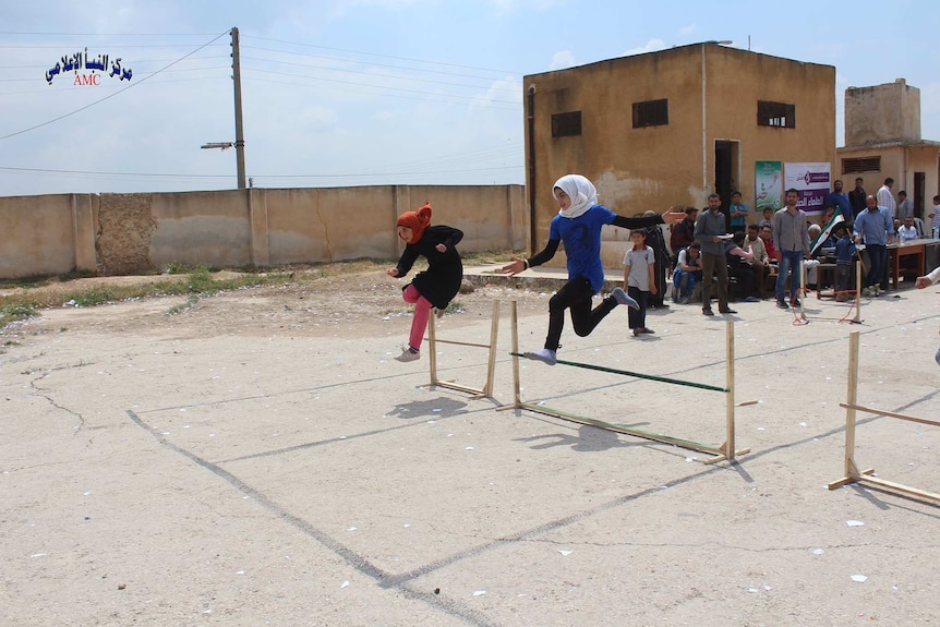 Children compete in hurdles in Aleppo