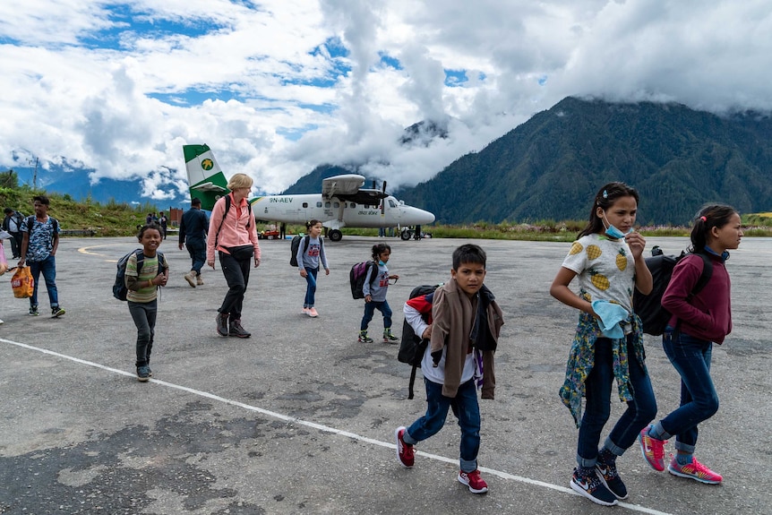 Children walk across the tarmac at Simikot Airport.