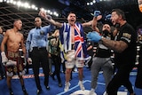 George Kambosos Jr has his hand raised in the arm as he becomes the World Lightweight champion
